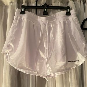 White alphalete shorts
